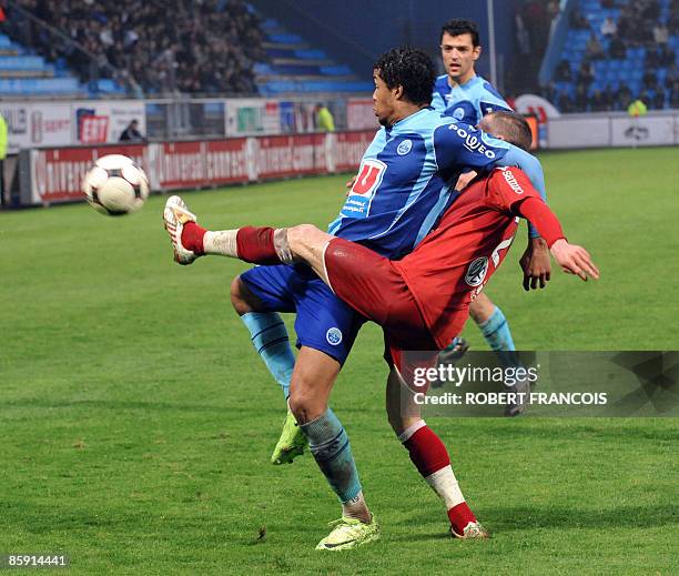 Le Havre's forward Kevin Anin vies with Caen's defender Reynald Lemaitre during their French L1 football match Le Havre vs. Caen, on April 11 at the...