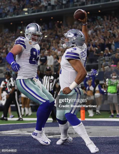 Dak Prescott celebrates his touchdown run with Jason Witten of the Dallas Cowboys in the fourth quarter against the Green Bay Packers at AT&T Stadium...