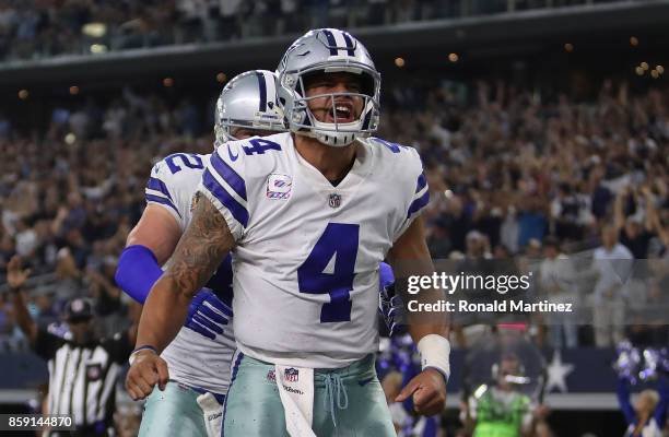 Dak Prescott celebrates his touchdown run with Jason Witten of the Dallas Cowboys in the fourth quarter against the Green Bay Packers at AT&T Stadium...