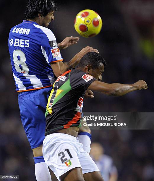 Porto's Argentinian Lucho Gonzalez vies with Estrela Amadora's Brazilian Ney Santos during their Portuguese First league football match at the Dragao...