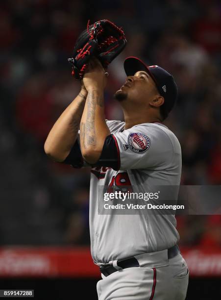 Pitcher Adalberto Mejia of the Minnesota Twins looks to the sky after leaving the game in the seventh inning during the MLB game against the Los...