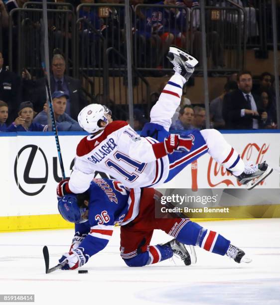 Mats Zuccarello of the New York Rangers gets under Brendan Gallagher of the Montreal Canadiens during a first period check at Madison Square Garden...