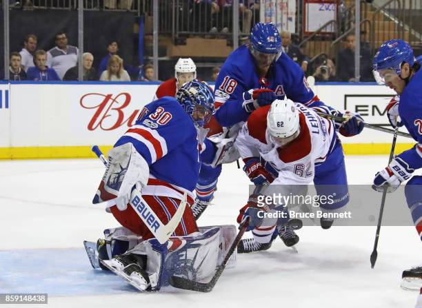 Henrik Lundqvist and Marc Staal of the New York Rangers defend against Artturi Lehkonen of the Montreal Canadiens during the first period at Madison...