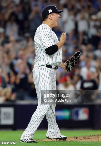 Masahiro Tanaka of the New York Yankees reacts after giving up a triple to Jason Kipnis of the Cleveland Indians during the fourth inning of game...