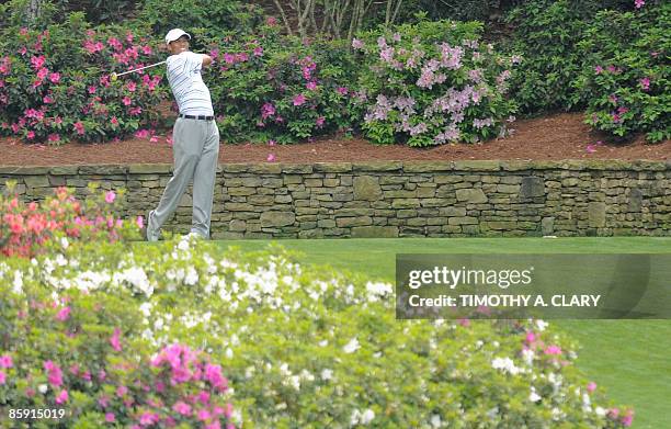 Golfer Tiger Woods tees off on the thirteenth hole during the third round of the US Masters at the Augusta National Golf Club on April 11, 2009. AFP...