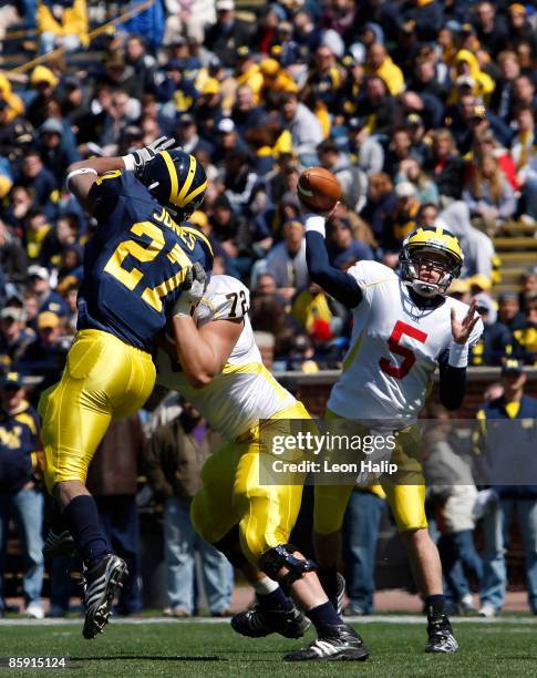 Quarterback Tate Forcier drops back to pass during the spring game at Michigan Stadium on April 11, 2009 in Ann Arbor Michigan.