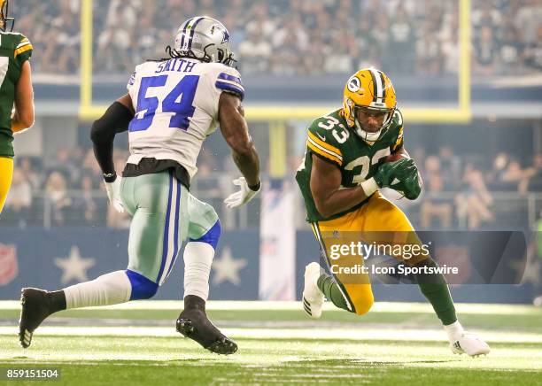 Green Bay Packers running back Aaron Jones is pursued by Dallas Cowboys outside linebacker Jaylon Smith during the football game between the Green...