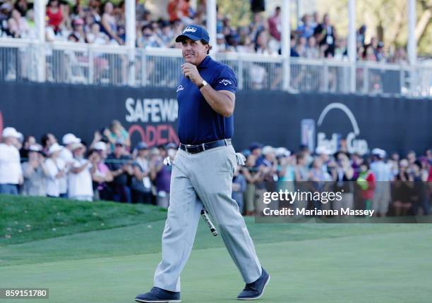Phil Mickelson reacts to his putt and the crowd after finishing his round on the 18th hole during the final round of the Safeway Open at the North...