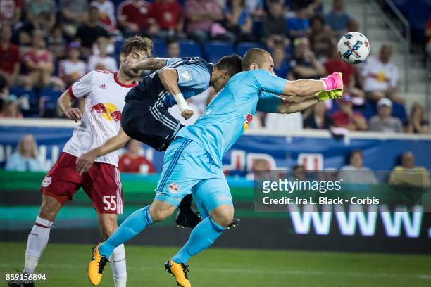 Goalkeeper Luis Robles of New York Red Bulls blocks the advance by Vancouver Whitecaps FC during the MLS match between New York Red Bulls and...