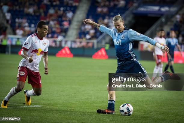 Brek Shea of Vancouver Whitecaps FC takes the shot on goal against Tyler Adams of New York Red Bulls during the MLS match between New York Red Bulls...