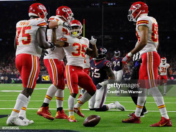 Charcandrick West of the Kansas City Chiefs celibrates with his teammates after a touchdown reception against the Houston Texans in the second...