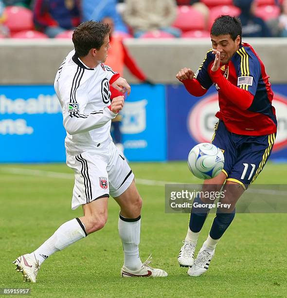 Javier Morales of Real Salt Lake blocks the kick of Marc Burch of D.C. United during the second half of MLS action at Rio Tinto Stadium April 11,...