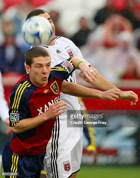 Will Johnson of Real Salt Lake heads butts the ball with Marc Burch of D.C. United during the second half of MLS action at Rio Tinto Stadium April...