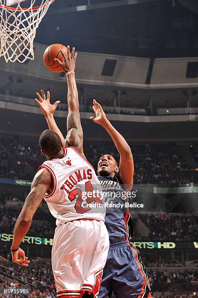 Boris Diaw of the Charlotte Bobcats has his shot blocked by Tyrus Thomas of the Chicago Bulls during the NBA game on April 11, 2009 at the United...