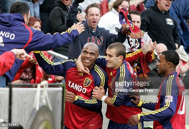 Jamison Olave of Real Salt Lake celebrates his goal with Yura Movsisyan and Robbie Findley in a game against D.C. United during the first half of MLS...