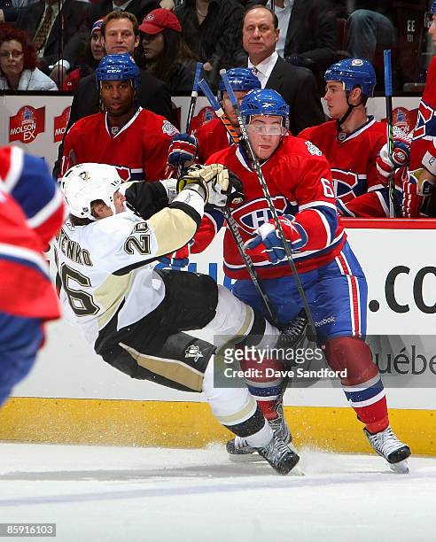 Ruslan Fedotenko of the Pittsburgh Penguins is hit by Yannick Weber of the Montreal Canadiens during their NHL game at the Bell Centre April 11, 2009...