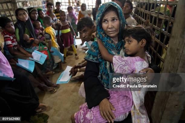 Patients wait for medical treatment in the urgent out patient waiting area at the 'Doctors Without Borders' Kutupalong clinic on October 4, 2017 in...