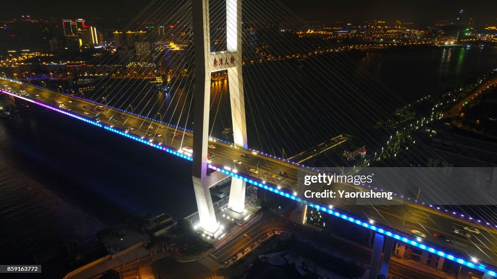 Aerial view of Nanpu bridge at night ,Shanghai ,China (by drone)