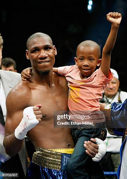 Paul Williams holds his son Paul Williams Jr. As he celebrates defeating Winky Wright in a unanimous decision in their middleweight bout at the...