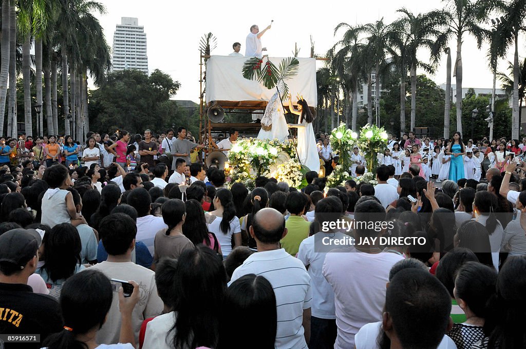 A Roman Catholic priest officiates a daw