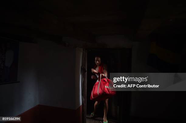 This photo taken on August 23, 2017 shows Nepali transgender person Monika Shahi Nath Yogi at her husband Ramesh Nath Yogi's family home in Kain Pani...