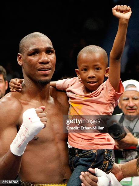 Paul Williams holds his son Paul Williams Jr. As he celebrates defeating Winky Wright in a unanimous decision in their middleweight bout at the...