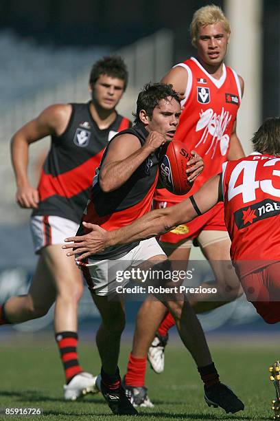 Rex Taylor of the Bombers is tackled during the round one VFL match between the Northern Bullants and the Bendigo Bombers at Visy Park on April 12,...