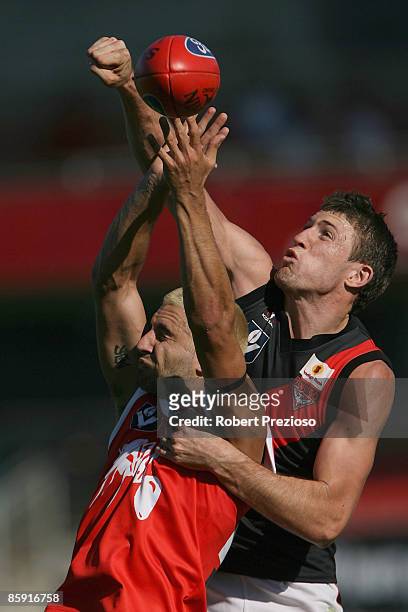 Adam Hartlett of the Bullants flies for a mark during the round one VFL match between the Northern Bullants and the Bendigo Bombers at Visy Park on...