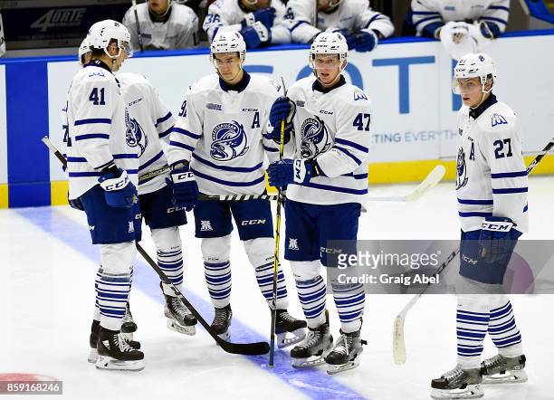 Nicolas Hague, Ryan McLeod, Trent Fox and Jacob Moverare of the Mississauga Steelheads get together at a time out against the Sudbury Wolves during...