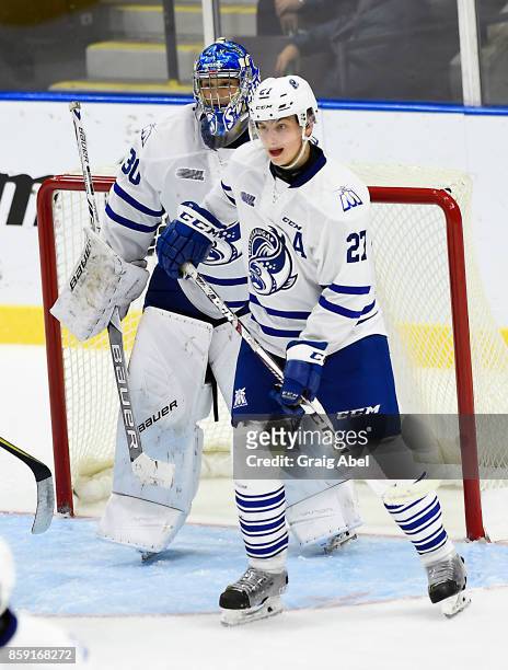 Jacob Moverare and Emanuel Vella of the Mississauga Steelheads prepare for a shot against the Sudbury Wolves during CHL game action on October 6,...