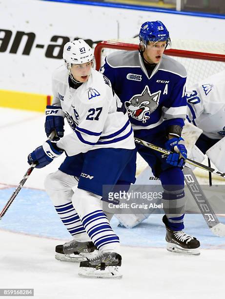 Jacob Moverare of the Mississauga Steelheads fights for crease space with Michael Pezzetta of the Sudbury Wolves during CHL game action on October 6,...