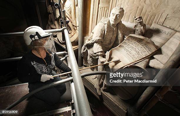 Conservator Cat Clarke cleans a statue of composer George Frideric Handel at Poets Corner in Westminster Abbey on April 8, 2009 in London. Handel,...