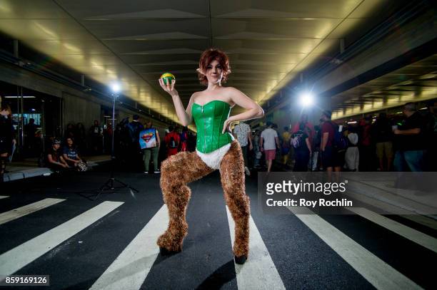 Fan cosplays as Elora from Spyro the Dragon during the 2017 New York Comic Con - Day 4 on October 8, 2017 in New York City.