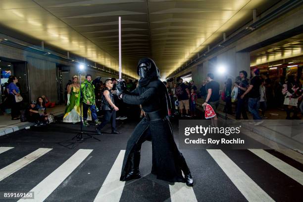 Fan cosplays as Kylo Ren from Starwars during the 2017 New York Comic Con - Day 4 on October 8, 2017 in New York City.