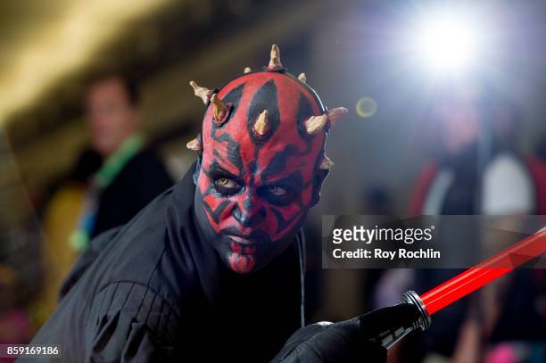 Fan cosplays as Darth Maul from Starwars during the 2017 New York Comic Con - Day 4 on October 8, 2017 in New York City.
