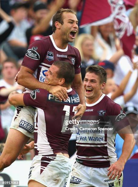Brett Stewart of the Sea Eagles celebrates with team mates after scoring his third try during the round five NRL match between the Manly Warringah...