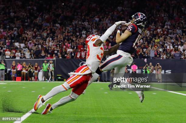 Will Fuller of the Houston Texans catches a touchdown pass defended by Jacoby Glenn of the Kansas City Chiefs in the fourth quarter at NRG Stadium on...