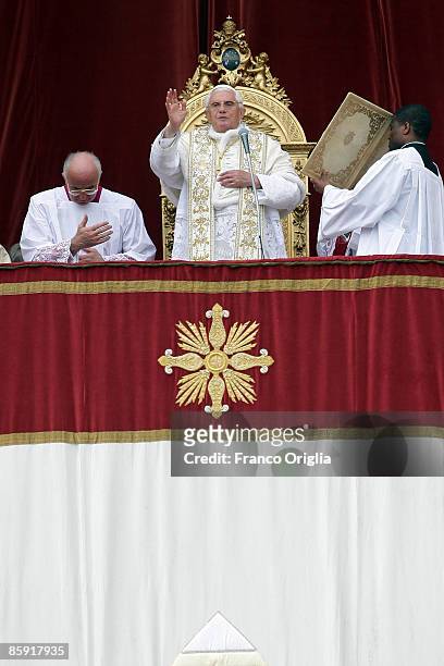 Pope Benedict XVI delivers his Easter Day mesage "urbi et orbi" blessing from the central balcony of St Peter's Basilica on April 12, 2009 in Vatican...