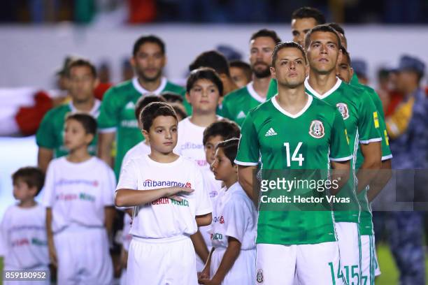 Javier Hernandez of Mexico observes one minute of silence in honor of Mexico erathquake victims prior to the match between Mexico and Trinidad &...
