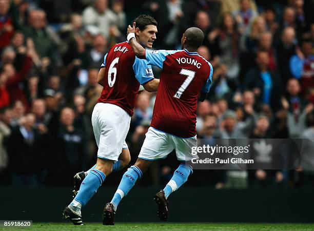 Gareth Barry of Aston Villa celebrates with Ashley Young after scoring a penalty to level the game 3-3 during the Barclays Premier League match...