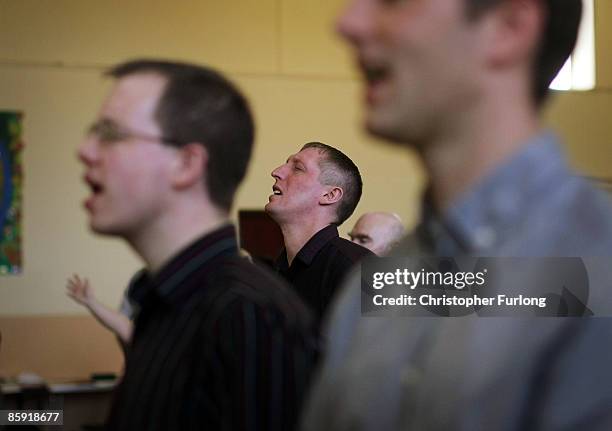 Customers and friends of Cafe Life on the Blacon estate take part in an Easter Sunday Miracle Service in a hall next to the cafe on April 12, 2009 in...