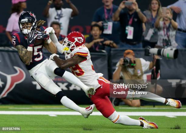 Will Fuller of the Houston Texans makes a reception for a touchdown as he slips behind Terrance Mitchell of the Kansas City Chiefs in the fourth...