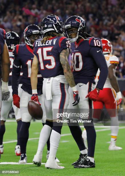 DeAndre Hopkins of the Houston Texans celebrates with Will Fuller after a touchdown in the fourth quarter at NRG Stadium on October 8, 2017 in...