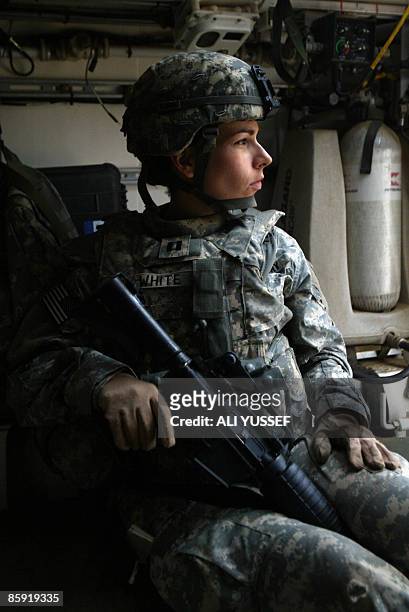Army officer sits in an armoured vehicle in Tarmiyah, north of Baghdad, on April 12, 2009. Violence in Iraq "remains at 2003 lows" and a 2011...