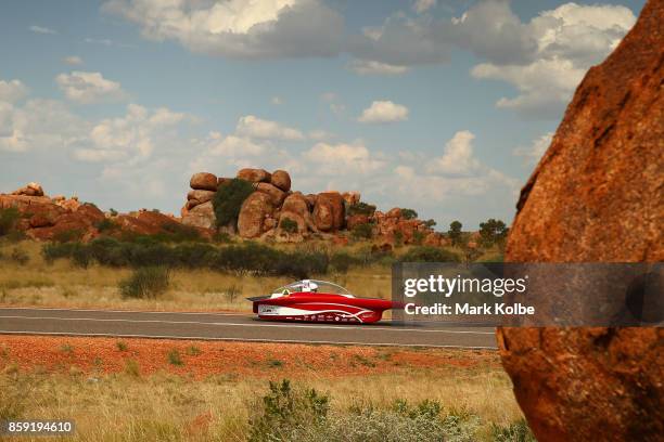 Solar Team Twente vehicle "RED Shift" of Netherland passes through the Devil's Marbles on Day 2 of the 2017 Bridgestone World Solar Challenge on...