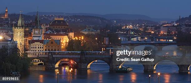 The Moldau River flows under the Charles Bridge and past buildings in Old Town on April 12, 2009 in Prague, Czech Republic. Prague is among Europe's...