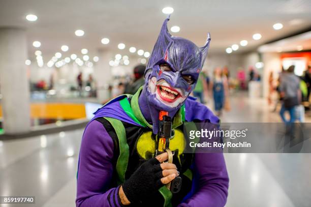 Fan cosplays as Joker Batman during the 2017 New York Comic Con - Day 4 on October 8, 2017 in New York City.