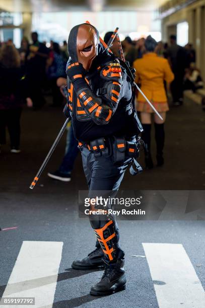 Fan cosplays as Deathstroke during the 2017 New York Comic Con - Day 4 on October 8, 2017 in New York City.