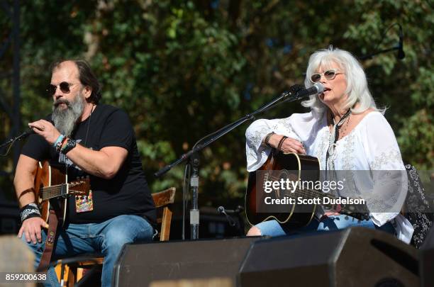 Singers Steve Earle and Emmylou Harris perform onstage as part of the Lampedusa: Concert for Refugees during Hardly Strictly Bluegrass festival at...