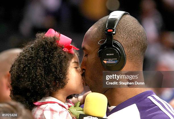 Kobe Bryant of the Los Angeles Lakers kisses daughter Gianna following the game with the Memphis Grizzlies on April 12, 2009 at Staples Center in Los...